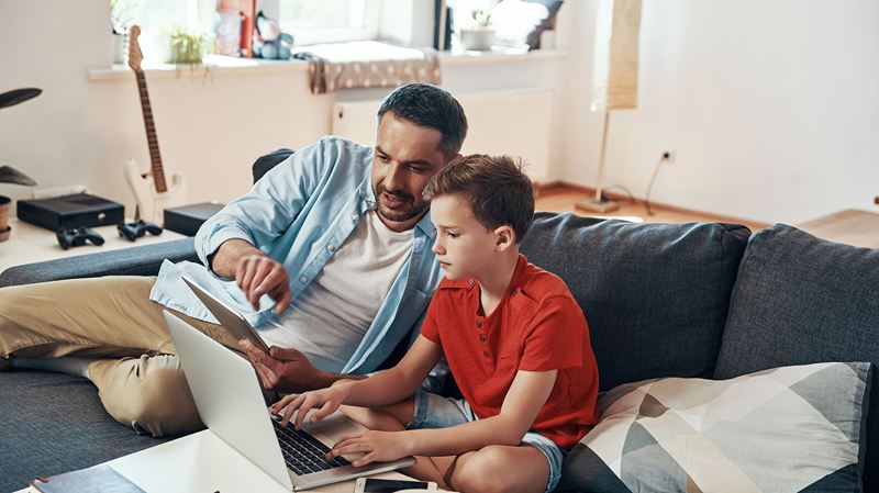 father and son on a laptop computer