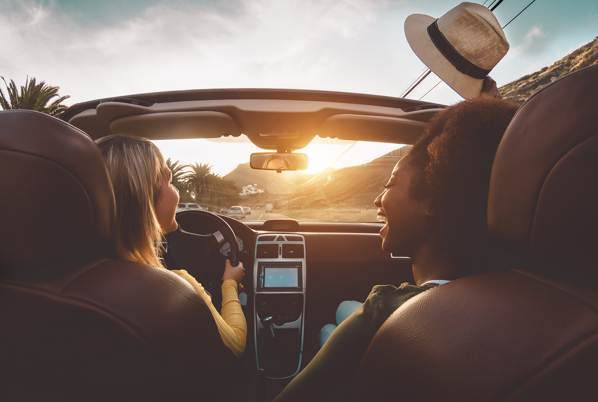 people in a convertable car